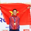 Vận động viên Phạm Thị Huệ đoạt huy chương vàng nội dung thi đơn nữ hạng nặng chèo đôi (W1X). (Ảnh: Minh Đức/TTXVN) 