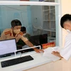 Triển khai thí điểm cấp đăng ký xe môtô tại Công an xã Tân Phước, thị xã La Gi, Bình Thuận. (Ảnh: Nguyễn Thanh/TTXVN)