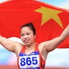 Vận động viên điền kinh dân tộc Thái Lò Thị Hoàng vui mừng khi giành tấm huy chương Vàng nội dung ném lao nữ với thành tích 56,37m, lập kỷ lục SEA Games. (Ảnh: Huy Hùng/TTXVN) 