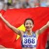 Vận động viên điền kinh Nguyễn Thị Oanh xuất sắc giành huy chương Vàng cá nhân nội dung chạy 3000m vượt chướng ngại vật nữ với thành tích 9 phút 52 giây 44, phá kỷ lục SEA Games (kỷ lục cũ 10 phút 00 giây 02). (Ảnh: Quang Hà/TTXVN)