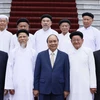 Chủ tịch nước Nguyễn Xuân Phúc và các đại biểu chức sắc các Hội thánh và Tổ chức Cao Đài. (Ảnh: Thống Nhất/TTXVN) 