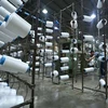 Hoạt động sản xuất tại nhà máy sợi Huế thuộc Công ty Cổ phần Dệt may Huế (Thừa Thiên-Huế). (Ảnh: TTXVN) 