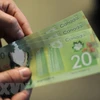 Đồng 20 đôla Canada. (Ảnh: AFP/TTXVN)