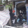 Hiện trường vụ cháy tại cửa hàng bán đồ sơ sinh số 311 phố Tôn Đức Thắng (quận Đống Đa-Hà Nội) khiến 4 người trong một gia đình bị thiệt mạng. (Nguồn: TTXVN)