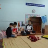 Người dân tránh trú bão ở trường Tiểu học Quang Trung (phường Mân Thái, quận Sơn Trà, thành phố Đà Nẵng). (Ảnh: Võ Văn Dũng/TTXVN)