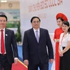 Thủ tướng Phạm Minh Chính đến dự Ngày chuyển đổi số quốc gia. (Ảnh: Dương Giang/TTXVN)