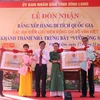 Đón nhận Bằng xếp hạng di tích quốc gia cho các địa điểm lưu niệm Thủ tướng Võ Văn Kiệt. (Ảnh: Lê Thúy Hằng/TTXVN)