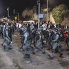 Cảnh sát Israel đụng độ với người Palestine. (Nguồn: AFP/TTXVN)