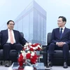 Thủ tướng Phạm Minh Chính và Chủ tịch Samsung Electronics Lee Jae-yong. (Ảnh: Dương Giang/TTXVN)