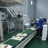 Đóng gói sản phẩm gạo xuất khẩu tại nhà máy của Công ty Cổ phần Nông nghiệp công nghệ cao Trung An, quận Thốt Nốt, thành phố Cần Thơ. (Ảnh: Vũ Sinh/TTXVN) 