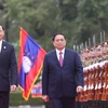 Thủ tướng Phạm Minh Chính và Thủ tướng Lào Sonexay Siphandone duyệt đội danh dự. (Ảnh: Dương Giang/TTXVN 