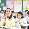 Trẻ em bỏ khẩu trang trong lớp học tại thành phố Daegu, Hàn Quốc sau khi nước này chính thức bãi bỏ quy định bắt buộc đeo khẩu trang trong hầu hết các không gian công cộng trong phòng kín, ngày 30/1/2023. (Ảnh: Yonhap/TTXVN)
