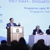 Thủ tướng Phạm Minh Chính phát biểu tại Diễn đàn Doanh nghiệp Việt Nam-Singapore. (Ảnh: Dương Giang/TTXVN) 