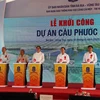 Phó Thủ tướng Trần Hồng Hà cùng lãnh đạo 2 tỉnh Bà Rịa-Vũng Tàu, Đồng Nai tiến hành nghi thức nhấn nút khởi công dự án. (Ảnh: Đoàn Mạnh Dương/TTXVN)