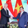 Thủ tướng Phạm Minh Chính và Thủ tướng nước Cộng hòa Singapore Lý Hiển Long. (Ảnh: Dương Giang/TTXVN) 