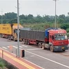 Xe vận chuyển hàng hóa qua Cửa khẩu quốc tế Móng Cái. (Ảnh: Văn Đức/TTXVN) 