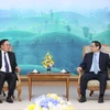 Thủ tướng Phạm Minh Chính tiếp Bộ trưởng Kế hoạch và Đầu tư Lào Khamchen Vongphosy. (Ảnh: Dương Giang/TTXVN)
