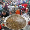 Quầy bán Thắng cố tại chợ phiên Mèo Vạc. (Ảnh: Trần Việt/TTXVN) 