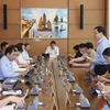 Đoàn đại biểu Quốc hội các tỉnh Phú Thọ, Quảng Trị và Bình Dương thảo luận. (Ảnh: Doãn Tấn/TTXVN) 