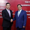 Thủ tướng Chính phủ Phạm Minh Chính và Thủ tướng Campuchia Samdech Hun Manet tại Trường Đại học Ngoại thương. (Ảnh: Phạm Kiên/TTXVN)