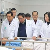 Thủ tướng Phạm Minh Chính chúc Tết bệnh nhân đang điều trị tại Bệnh viện hữu nghị Việt Đức. (Ảnh: PV/Vietnam+)