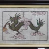 Tranh rồng được nghệ nhân ưu tú làng tranh Đông Hồ sáng tạo cho những người tuổi Thìn. (Ảnh: Thanh Thương/TTXVN)