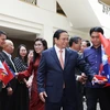 Thủ tướng Phạm Minh Chính và Phu nhân gặp gỡ cán bộ, nhân viên các cơ quan đại diện và cộng đồng người Việt Nam tại Australia. (Ảnh: Dương Giang/TTXVN)