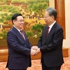 Chủ tịch Quốc hội Vương Đình Huệ với Ủy viên trưởng Ủy ban Thường vụ Nhân đại toàn quốc Trung Quốc Triệu Lạc Tế. (Ảnh: Nhan Sáng/TTXVN)