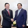 Thủ tướng Phạm Minh Chính tiếp Tổng Thư ký ASEAN Kao Kim Hourn. (Ảnh: Dương Giang/TTXVN)