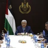 Tổng thống Palestine Mahmoud Abbas (giữa) chủ trì một cuộc họp của Ban lãnh đạo Palestine tại Ramallah, Bờ Tây. (Ảnh: AFP/TTXVN)