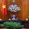 Thủ tướng Phạm Minh Chính chủ trì họp Thường trực Chính phủ về kiểm soát lạm phát. (Ảnh: Dương Giang/TTXVN)