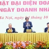 Thủ tướng Phạm Minh Chính gặp mặt đại diện doanh nghiệp nhân Ngày Doanh nhân Việt Nam (13/10). (Ảnh: Dương Giang/TTXVN)