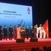 Ủy ban Chứng khoán Nhà nước đón nhận Huân chương Độc lập hạng Nhì. (Ảnh: TTXVN)