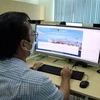 Toàn bộ hoạt động kê khai, nộp phí, xuất biên lai việc thu phí cảng biển được thực hiện trực tuyến trên hệ thống hải quan điện tử hoặc cổng thông tin Cảng vụ Đường thủy nội địa Thành phồ Hồ Chí Minh. (Ảnh: Tiến Lực/TTXVN)