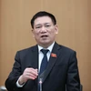 Bộ trưởng Bộ Tài chính Hồ Đức Phớc trao đổi về công tác triển khai các nhiệm vụ của Bộ trong năm 2023. (Ảnh: Vietnam+)