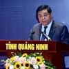 Bộ Trưởng Bộ Kế hoạch và Đầu tư Nguyễn Chí Dũng công bố Nghị quyết số 14 /NQ-CP. (Ảnh: Vietnam+)