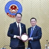 Bộ trưởng Bộ Tài chính Hồ Đức Phớc làm việc với iám đốc Cơ quan Dịch vụ Tài chính Nhật Bản. (Ảnh: CTV/Vietnam+)