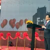 Phó Thủ tướng Vũ Đức Đam phát biểu chúc mừng FPT và kỳ vọng sẽ có nhiều làng phần mềm trên toàn quốc. (Ảnh: T.H/Vietnam+)