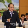 Bộ trưởng Trương Minh Tuấn trả lời tại phiên chất vấn chiều 18/4. (Ảnh: Phương Hoa/TTXVN)