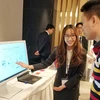 Giới thiệu giải pháp công nghệ của Fujitsu tại Hội nghị. (Ảnh: T.H/Vietnam+)