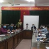 Cuộc họp khẩn của Hà Nội trước thông tin ca mắc COVID-19 thứ 39. (Ảnh: PV/Vietnam+)
