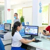 VNPT đảm bảo quy tắc phòng dịch trong hoạt động sản xuất kinh doanh. (Ảnh: T.Q/Vietnam+)
