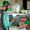 Nhờ Gojek, nhiều người kinh doanh ẩm thực online đã tiếp cận được với tệp khách hàng rộng lớn, gia tăng doanh số bán hàng. (Ảnh: PV/Vietnam+)