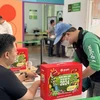 Gojek tri ân nỗ lực bền bỉ của các đối tác tài xế bằng chuỗi hoạt động đón Tết đầy ý nghĩa. (Ảnh: PV/Vietnam+)