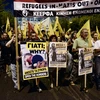 Tuần hành ủng hộ người di cư tại Athens, Hy Lạp ngày 12/9. (Nguồn: AFP/TTXVN)