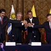 Trong ảnh (từ trái sang phải): Tổng thống Venezuela Nicolas Maduro, Tổng thống Uruguay Tabare Vazquez, Tổng thống Ecuador Rafael Correa và Tổng thống Colombia Juan Santos sau cuộc gặp tại Quito. (Nguồn: AFP/TTXVN)