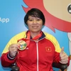 Vận động viên cử tạ Châu Hoàng Tuyết Loan đã mang về huy chương vàng cho đoàn thể thao Việt Nam.(Ảnh: Lê Hải-Việt Hải/TTXVN)