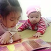 Hai bé nhà chị Kiều Phương Giang ngoan ngoãn và đáng yêu. (Ảnh: T.G/Vietnam+)