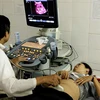 Chẩn đoán qua siêu âm cho thai phụ. (Ảnh: TTXVN/Vietnam+)