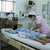  Trẻ điều trị sốt xuất huyết tại bệnh viện Nhiệt Đới Thành phố Hồ Chí Minh. (Ảnh: TTXVN/Vietnam+)